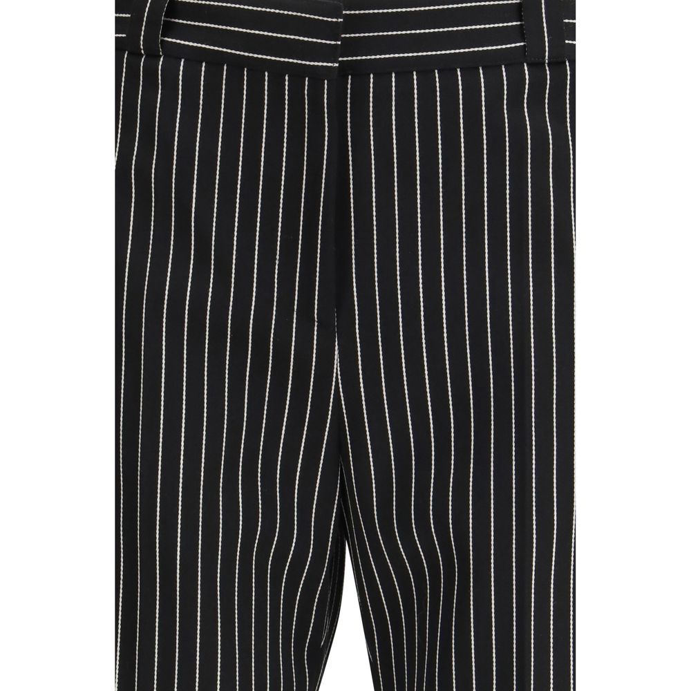 Elevate your style with Tom Ford Black Fleece Wool Chino Pants, crafted from premium materials for unparalleled comfort and sophistication in every occasion.
