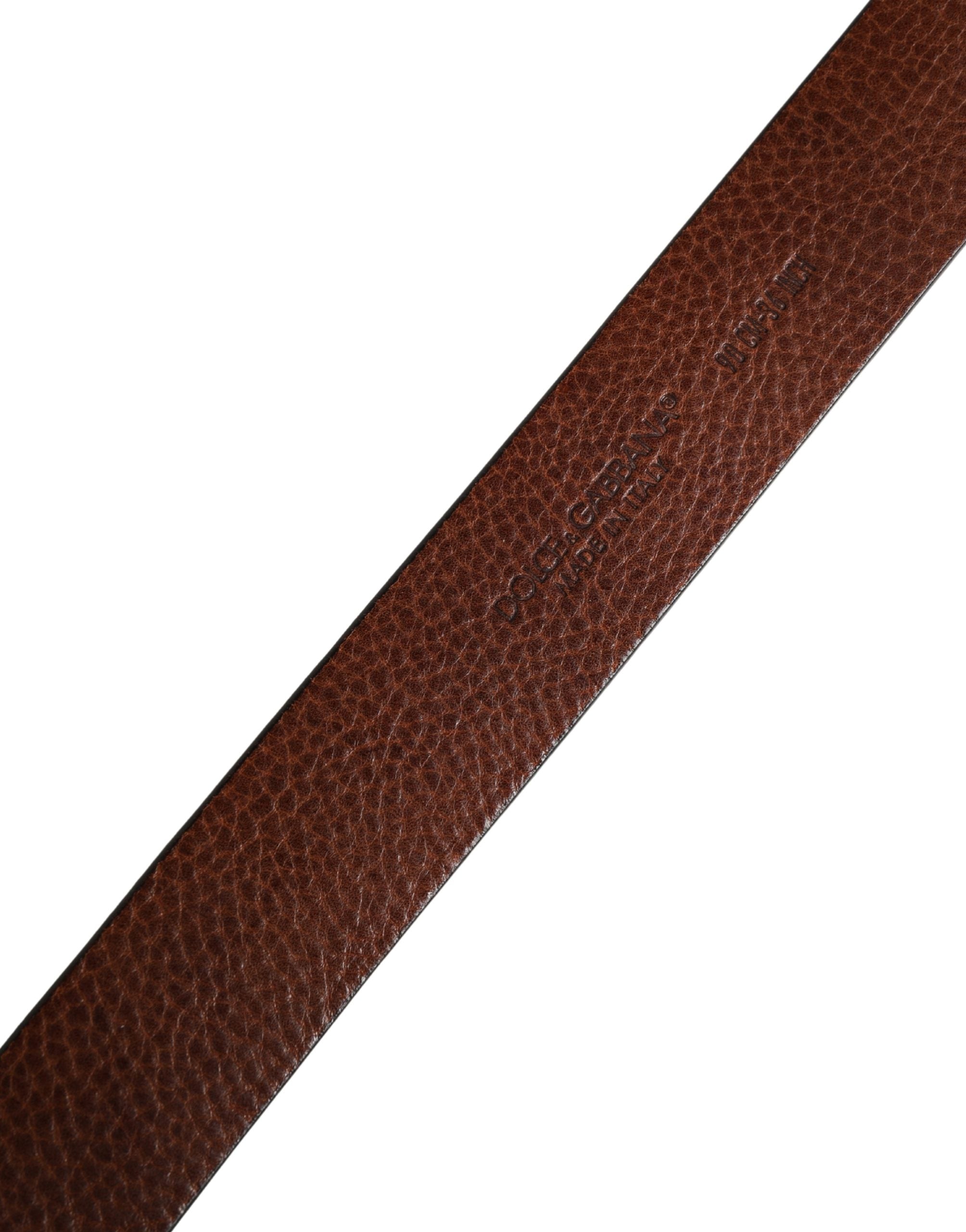 Elevate your style with the Dolce & Gabbana Men Brown Classic Leather Metal Buckle Belt, a testament to Italian craftsmanship and timeless elegance, crafted from luxurious calf leather.