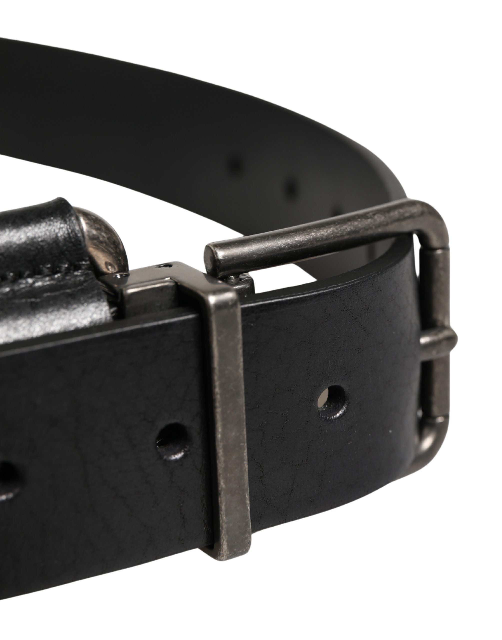 Elevate your style with the Dolce & Gabbana Black Calf Leather Silver Metal Buckle Belt, a masterpiece of Italian craftsmanship that embodies timeless luxury and sophistication.