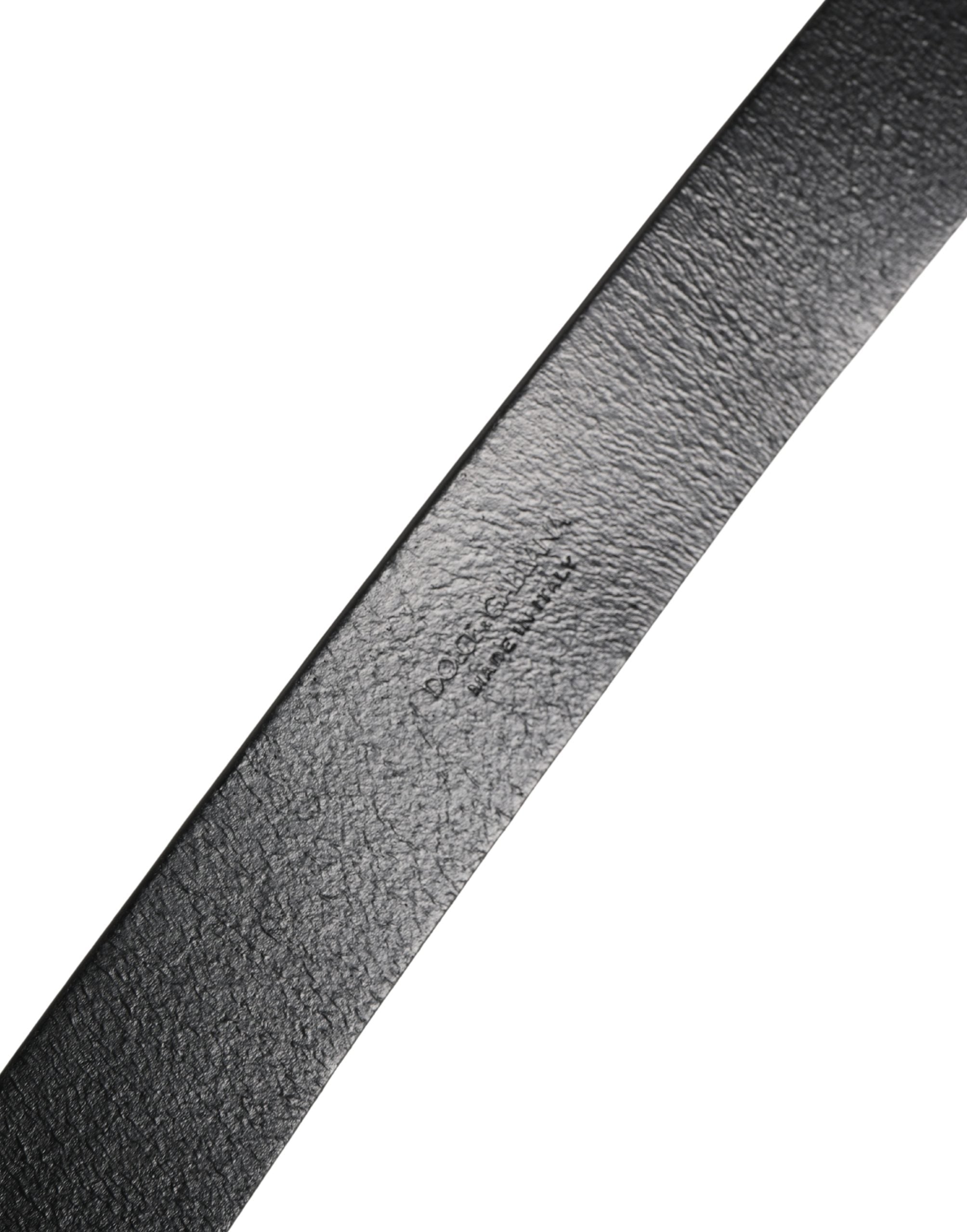 Discover the Dolce & Gabbana Black Calf Leather Silver Metal Buckle Belt, a masterpiece of Italian craftsmanship that elevates any ensemble with timeless sophistication.