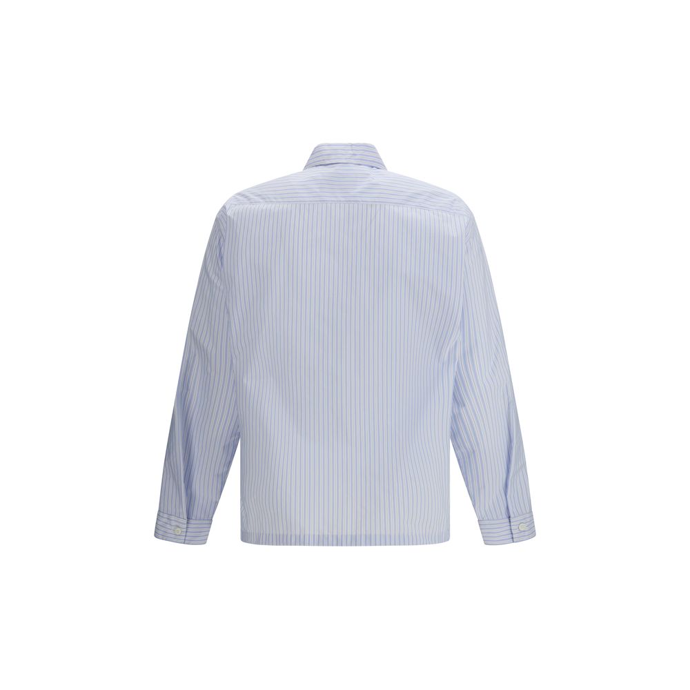 Elevate your wardrobe with the Prada Blue Polyamide Pattern Shirt, a sustainable luxury crafted from innovative re-nylon, perfect for every sophisticated occasion.