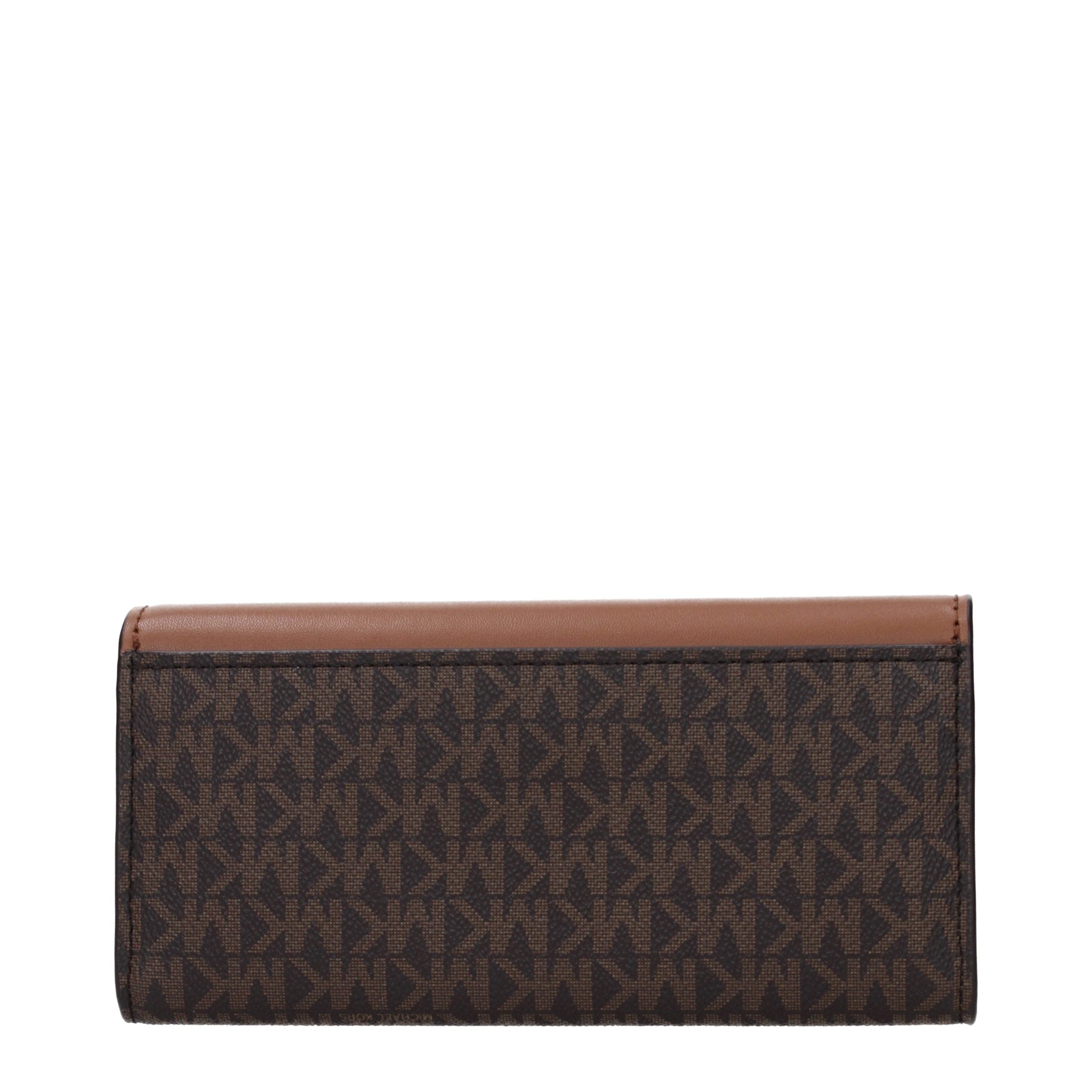 Elevate your elegance with the Michael Kors Brown Fabric Wallet, a luxurious accessory that embodies sophistication and timeless craftsmanship for discerning individuals.