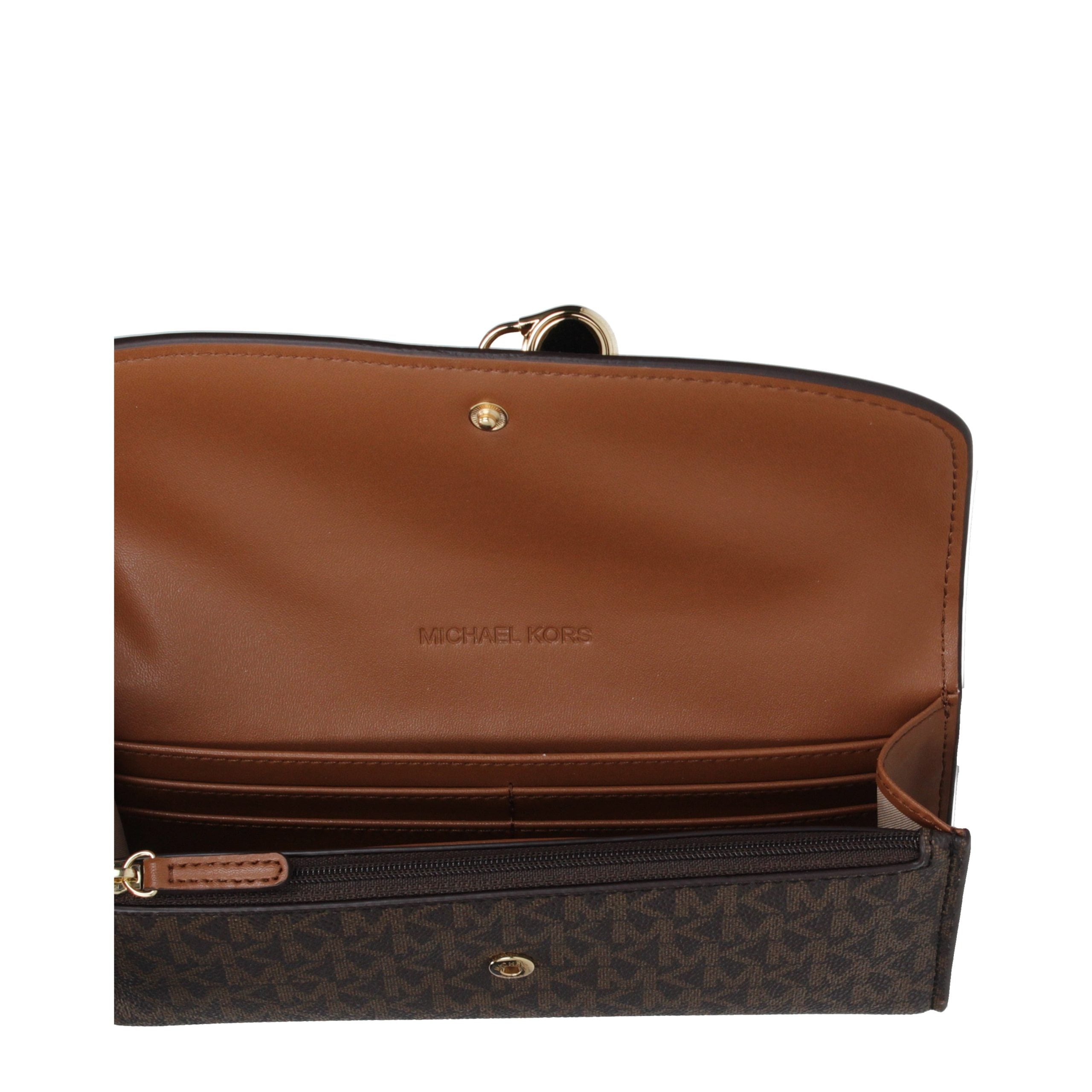 Discover the Michael Kors Brown Fabric Wallet, a luxurious accessory that embodies sophistication and elegance, perfect for the discerning individual.