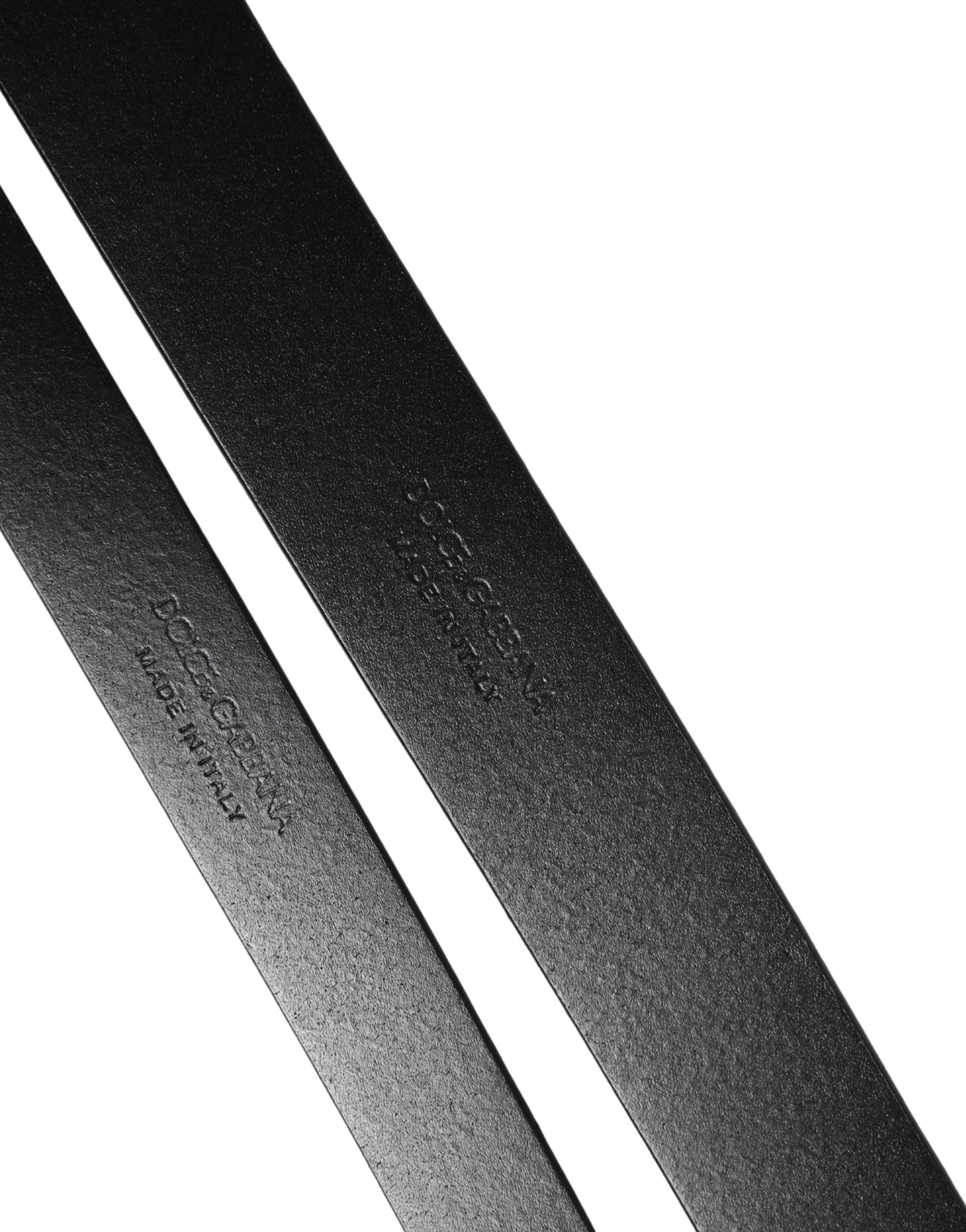Indulge in the exquisite Dolce & Gabbana Black Double Strap Leather Silver Buckle Belt, a testament to Italian craftsmanship and timeless elegance, perfect for the discerning individual.