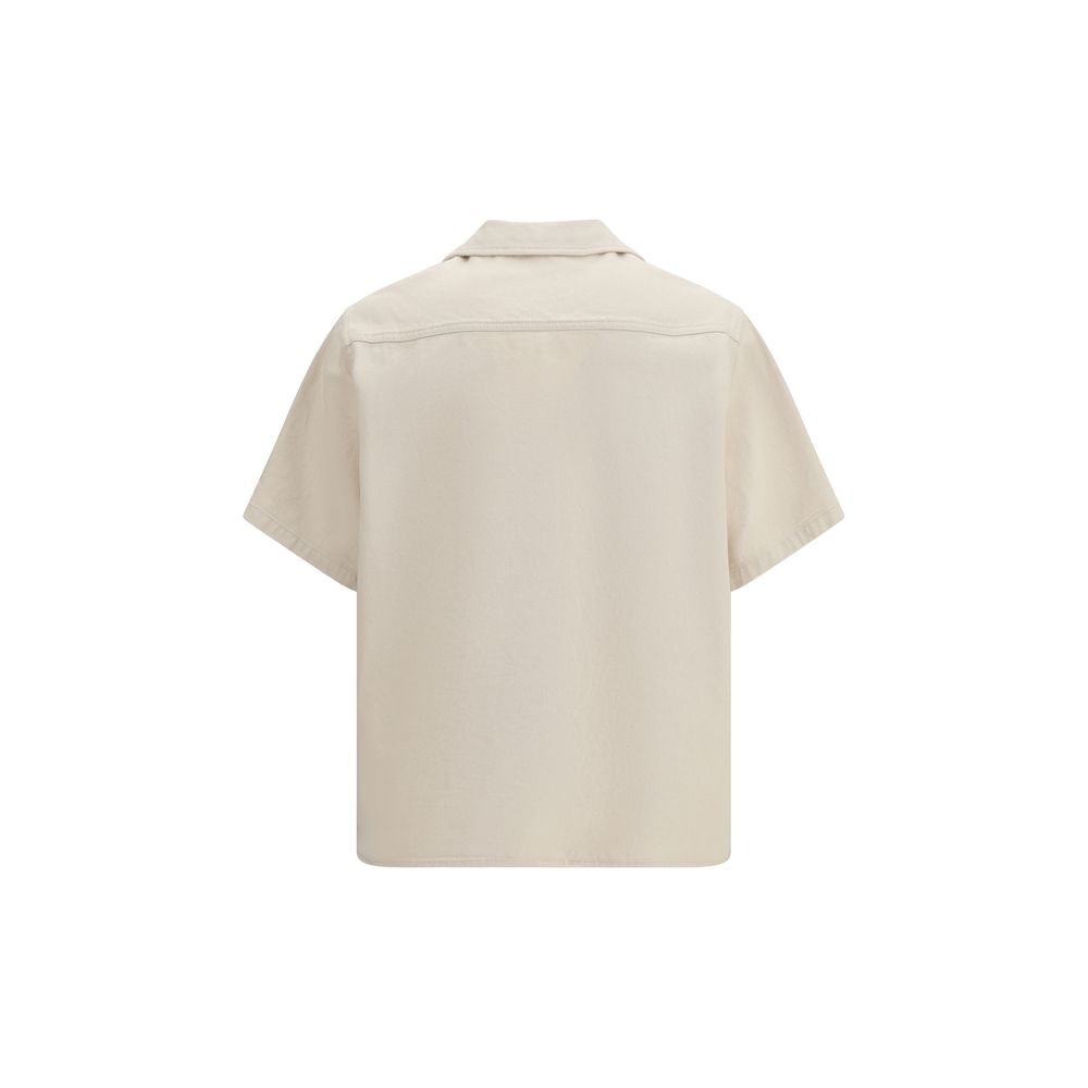 Indulge in the Valentino Beige Denim Shirt, a masterpiece of 100% cotton luxury from the SS26 collection, blending casual elegance with iconic V GOLD details for a timeless statement.