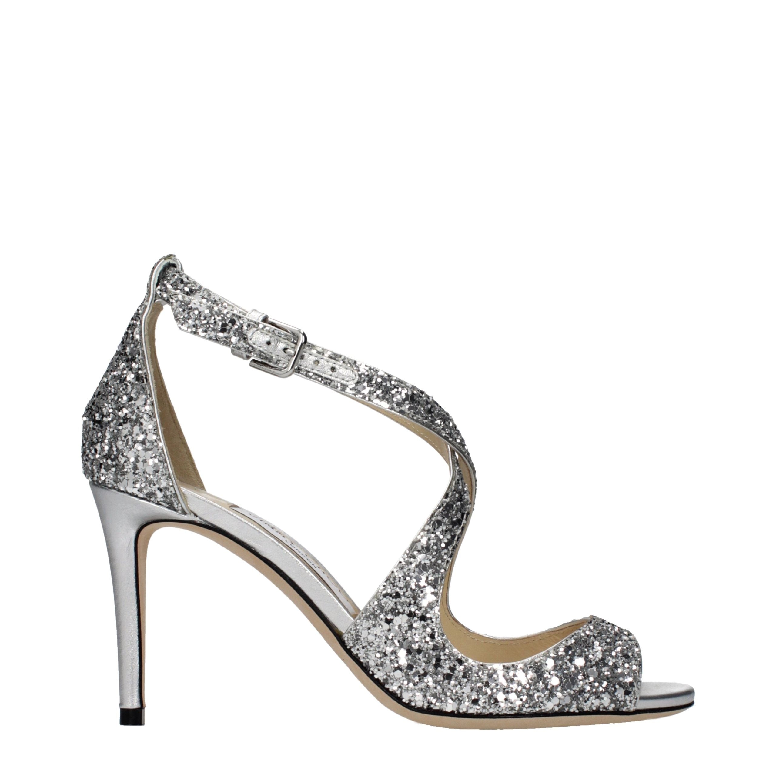 Indulge in the exquisite craftsmanship of Jimmy Choo Gray Plastic Strap-On Sandals, where luxurious design meets personalized comfort for the discerning fashion connoisseur.