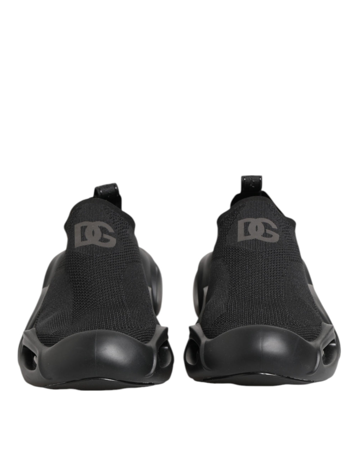 Indulge in the allure of Dolce & Gabbana's Black Slip On Wave Low Top Sneakers, where luxurious craftsmanship meets timeless elegance, perfect for any sophisticated occasion.