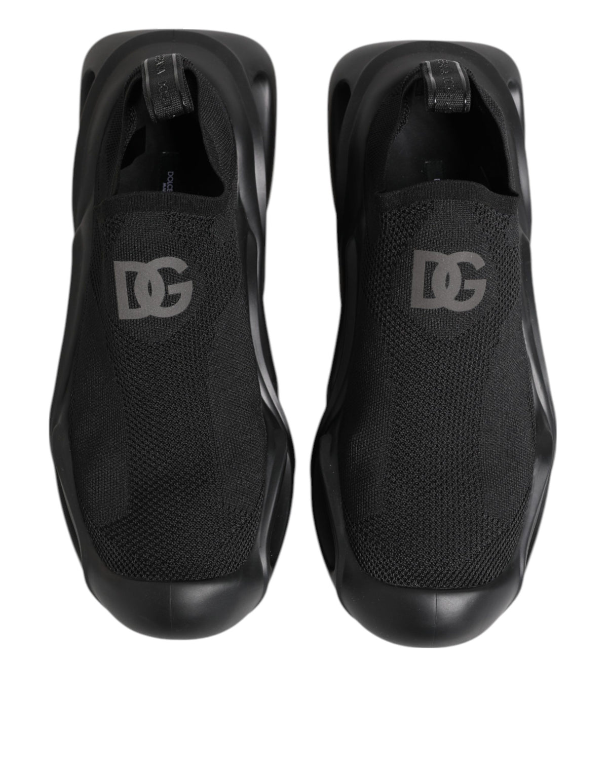 Indulge in the exquisite Dolce & Gabbana Black Slip On Wave Low Top Sneakers, where luxurious materials meet impeccable craftsmanship for a statement of refined elegance.