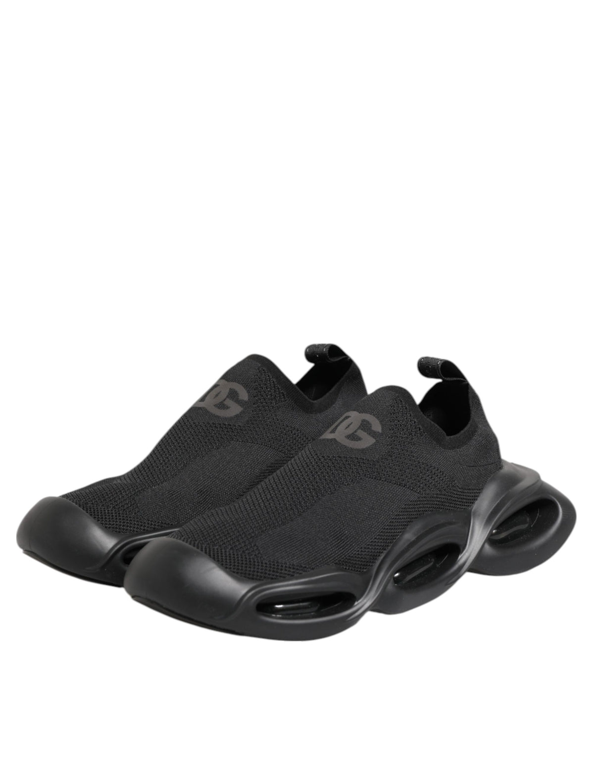 Step into the realm of luxury with Dolce & Gabbana's Black Slip On Wave Low Top Sneakers, where exquisite craftsmanship meets timeless elegance for the discerning individual.
