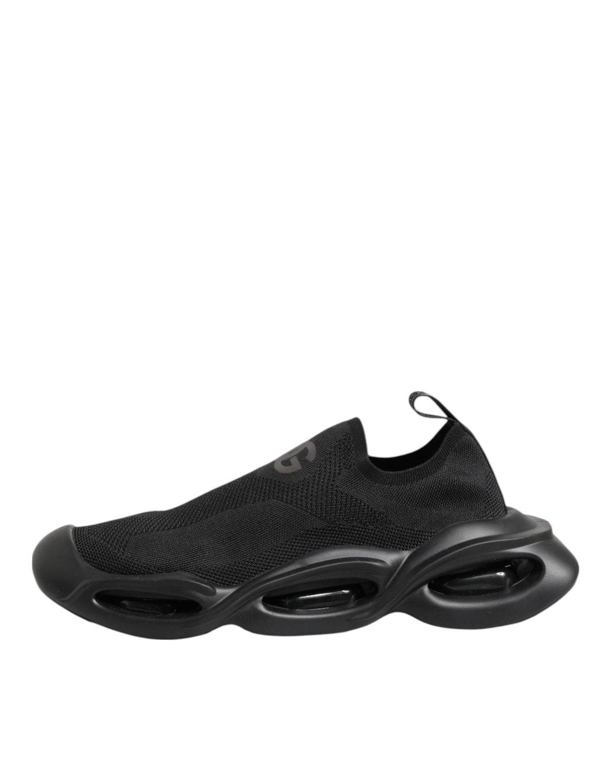 Elevate your style with Dolce & Gabbana's Black Slip On Wave Low Top Sneakers, where luxurious materials meet exquisite craftsmanship for an effortlessly chic statement.