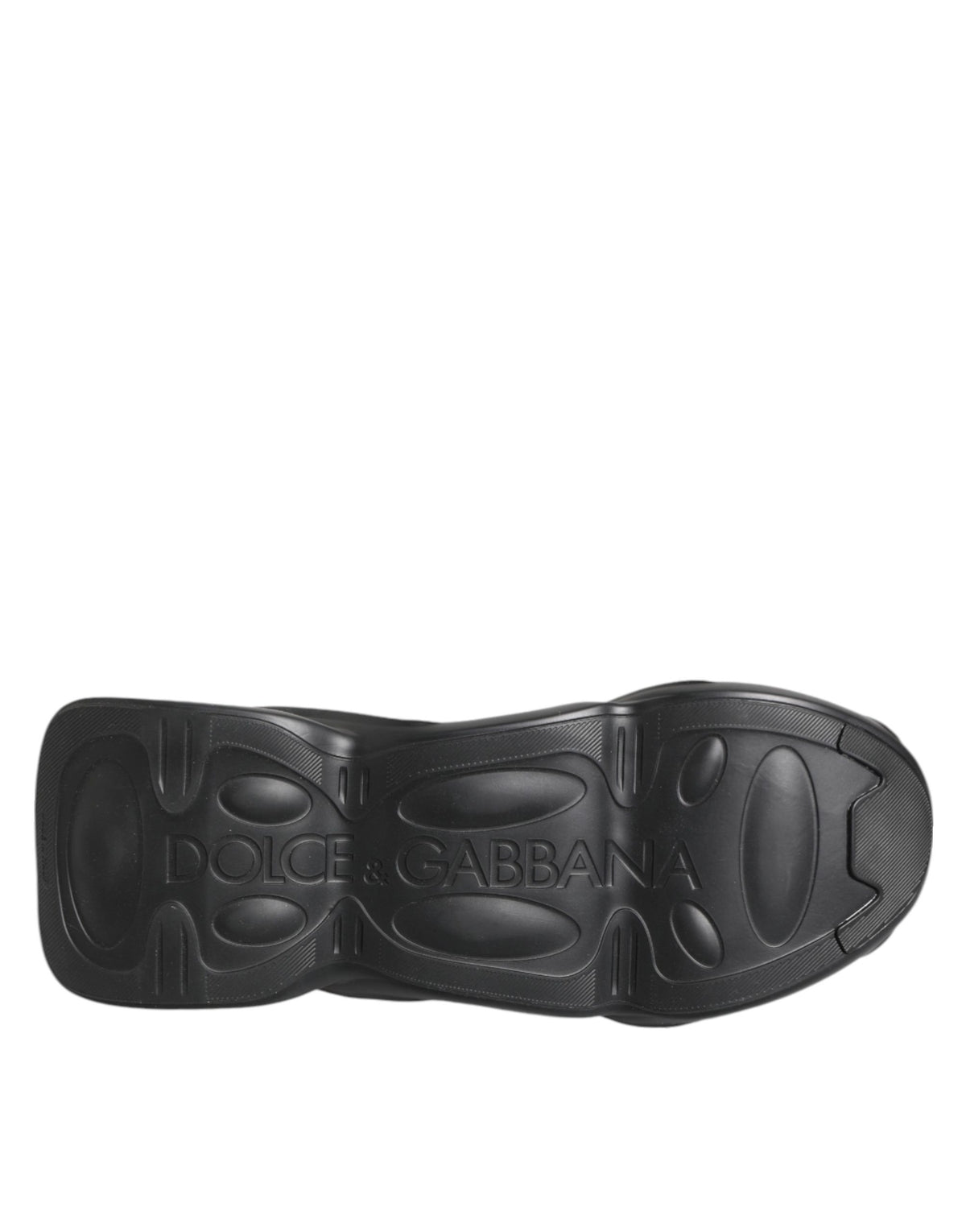 Indulge in the exquisite allure of Dolce & Gabbana's Black Slip On Wave Low Top Sneakers, where luxurious materials meet impeccable craftsmanship for a statement of refined elegance.