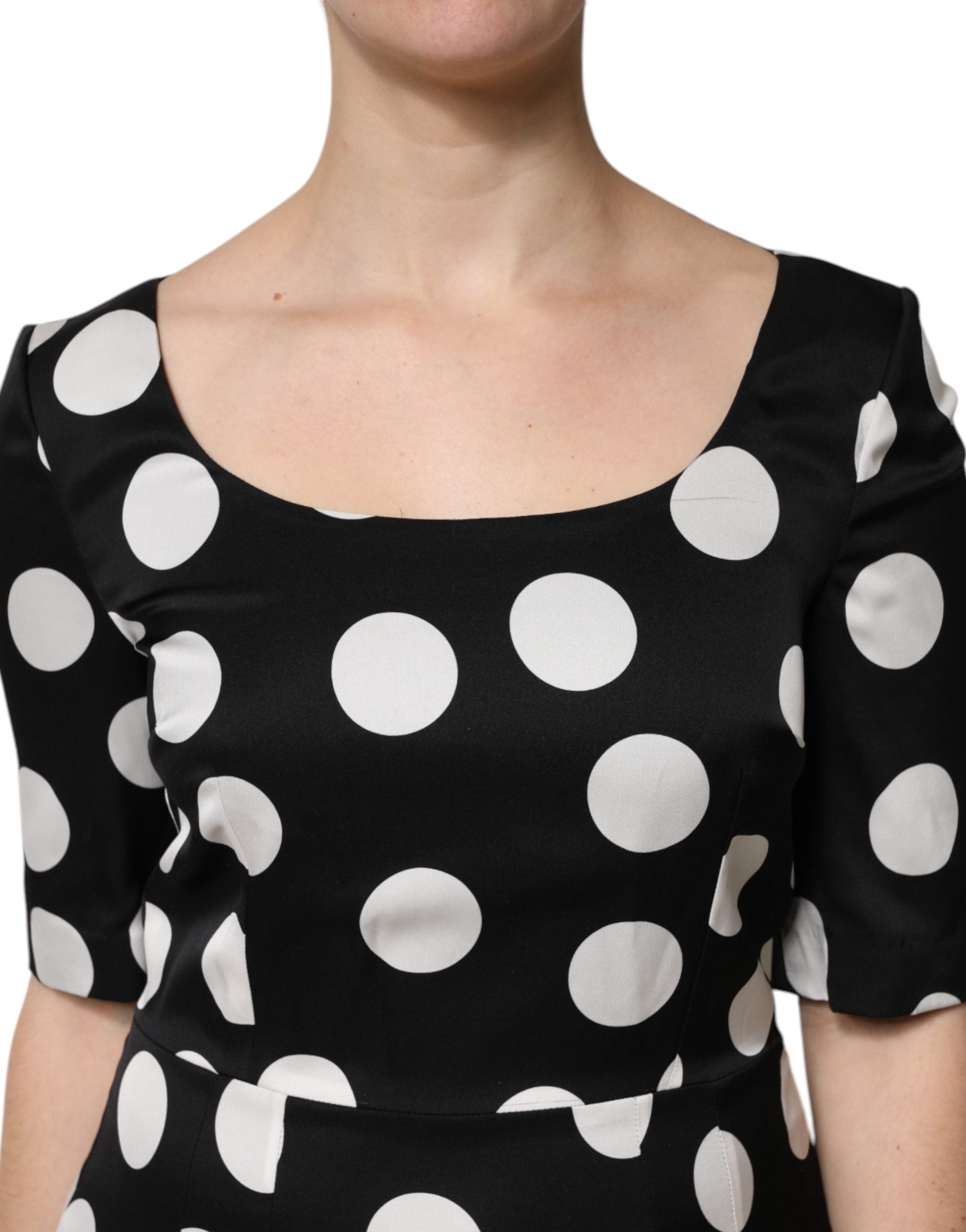 Indulge in the exquisite Dolce & Gabbana Black White Polka Dot Silk Sheath Midi Dress, a timeless piece crafted in Italy, embodying luxury and sophistication for every occasion.