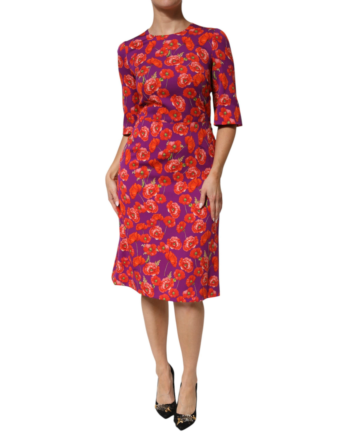 Indulge in the exquisite allure of the Dolce & Gabbana Purple Silk Floral Print Midi Sheath Dress, a masterpiece of Italian craftsmanship that redefines elegance and sophistication.