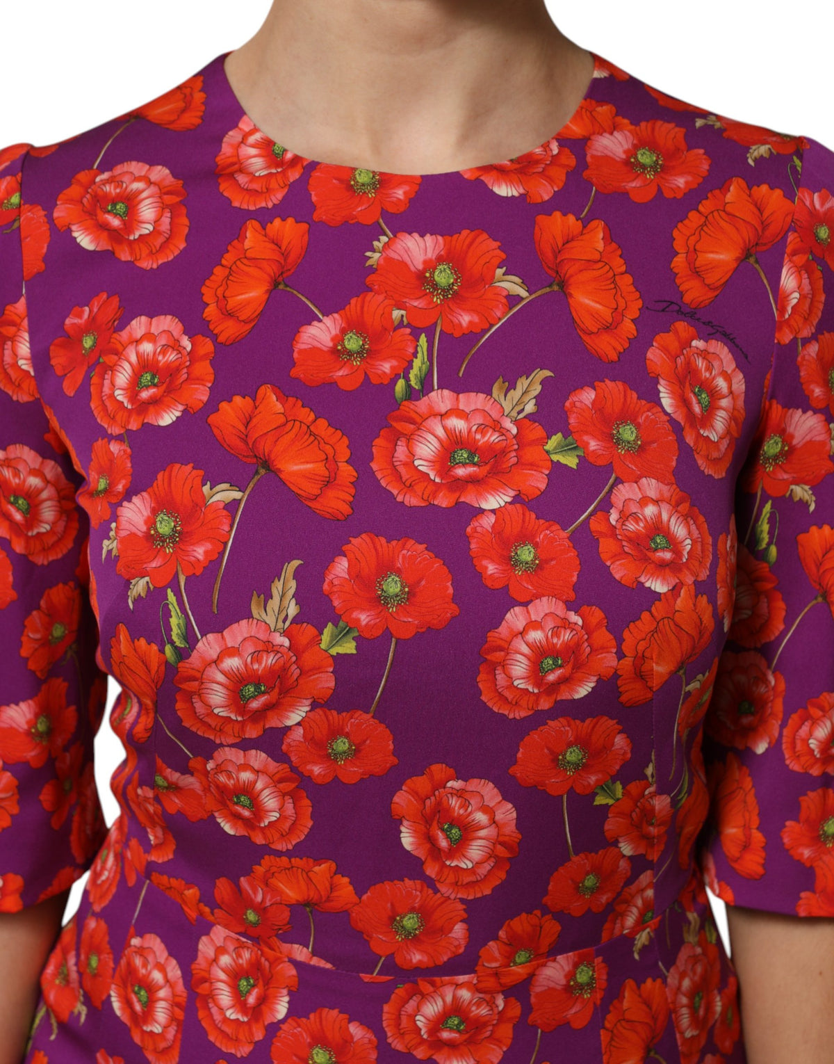 Indulge in the exquisite Dolce & Gabbana Purple Silk Floral Print Midi Sheath Dress, a celebration of Italian craftsmanship and luxurious elegance, perfect for any sophisticated occasion.