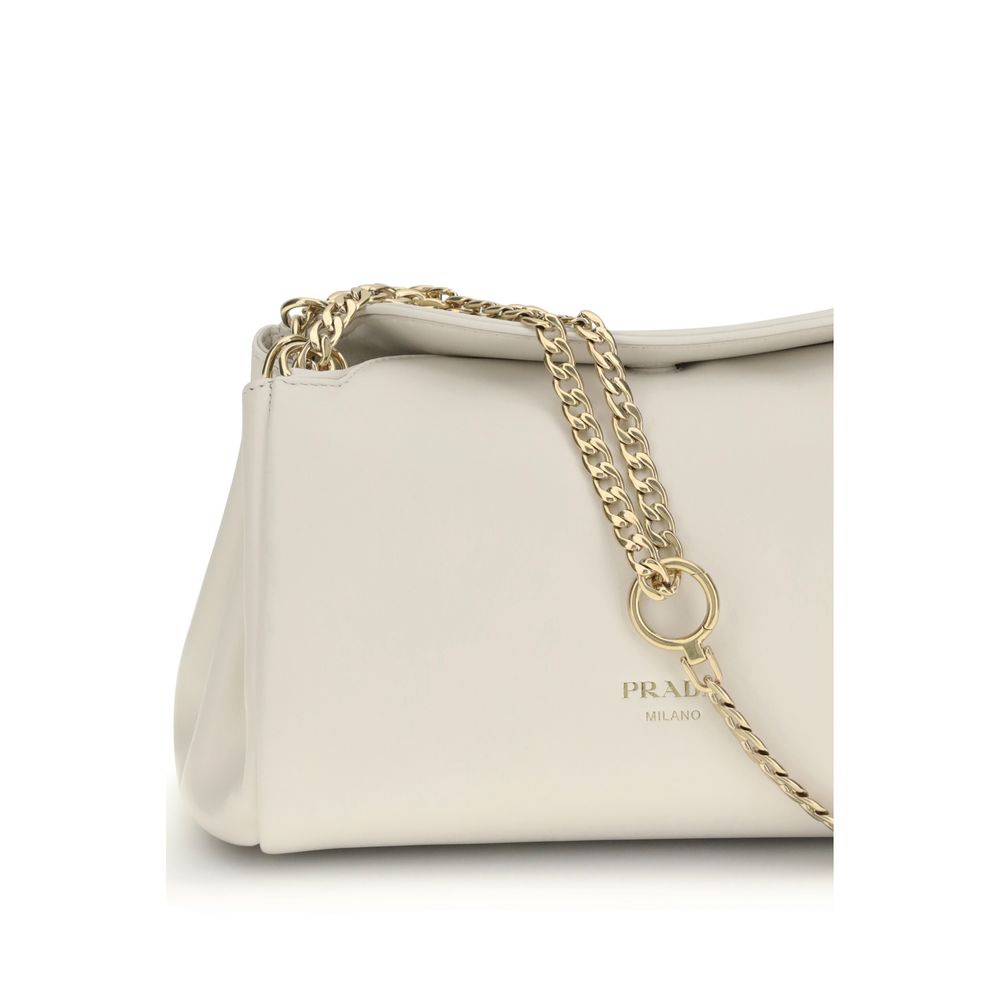 Discover the Prada White Calf Leather Bos Taurus Shoulder Bag, a masterpiece of luxury craftsmanship that elevates your style with timeless elegance and modern sophistication.