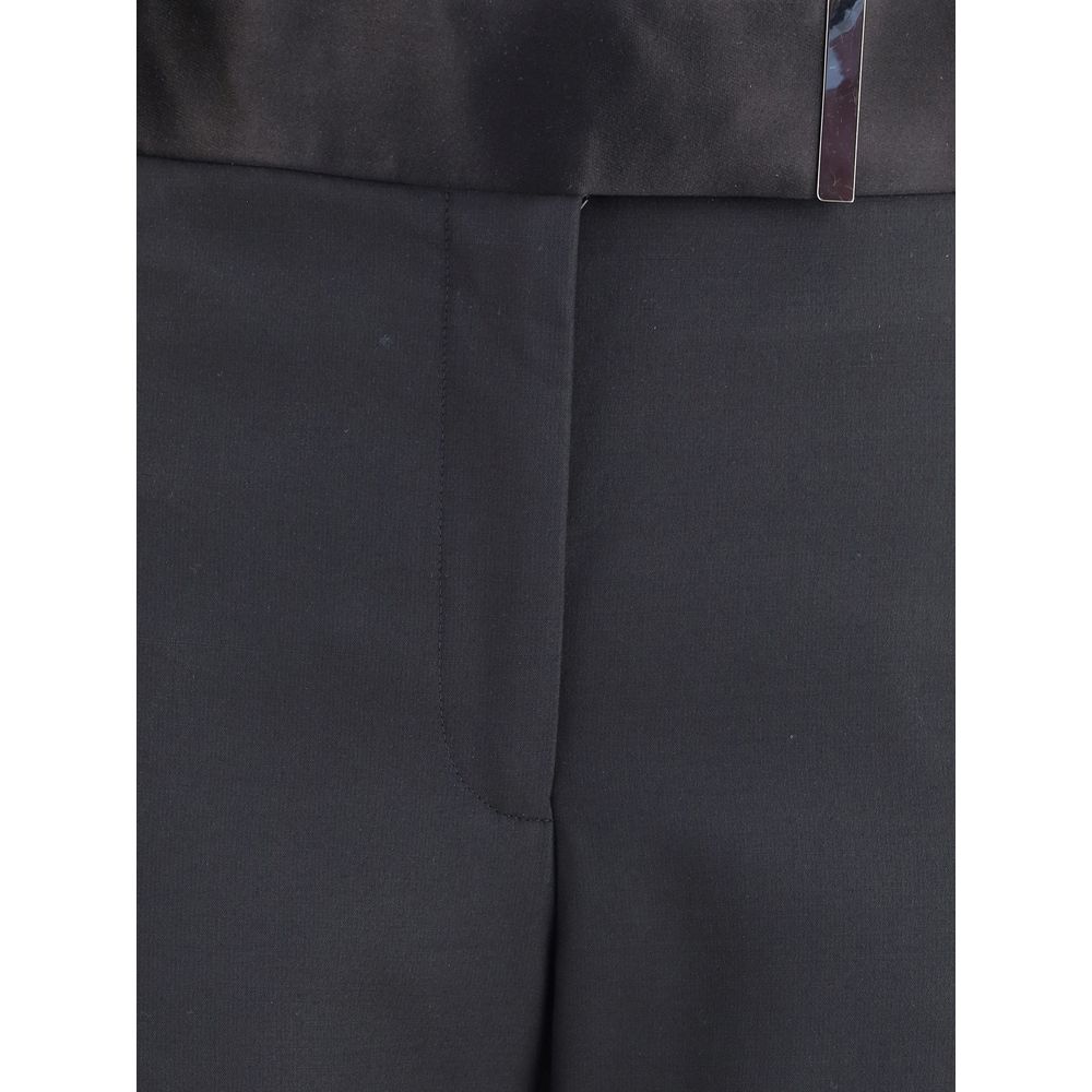 Indulge in the exquisite allure of Tom Ford Gold Silk Pants, crafted from luxurious silk and wool, embodying sophistication for every elegant occasion.