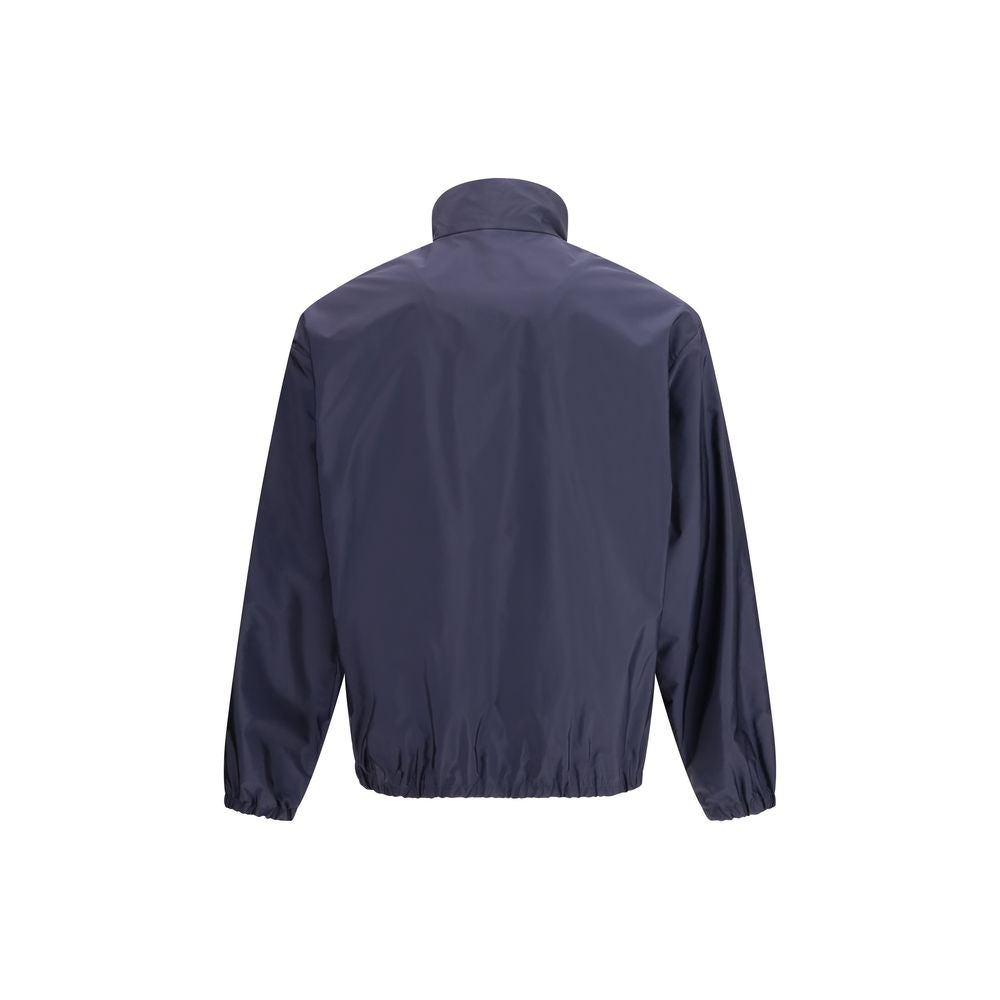 Discover the Prada Blue Recycled Polyamide Shell Jacket, a masterpiece of sustainable luxury that embodies elegance and sophistication for the discerning individual.