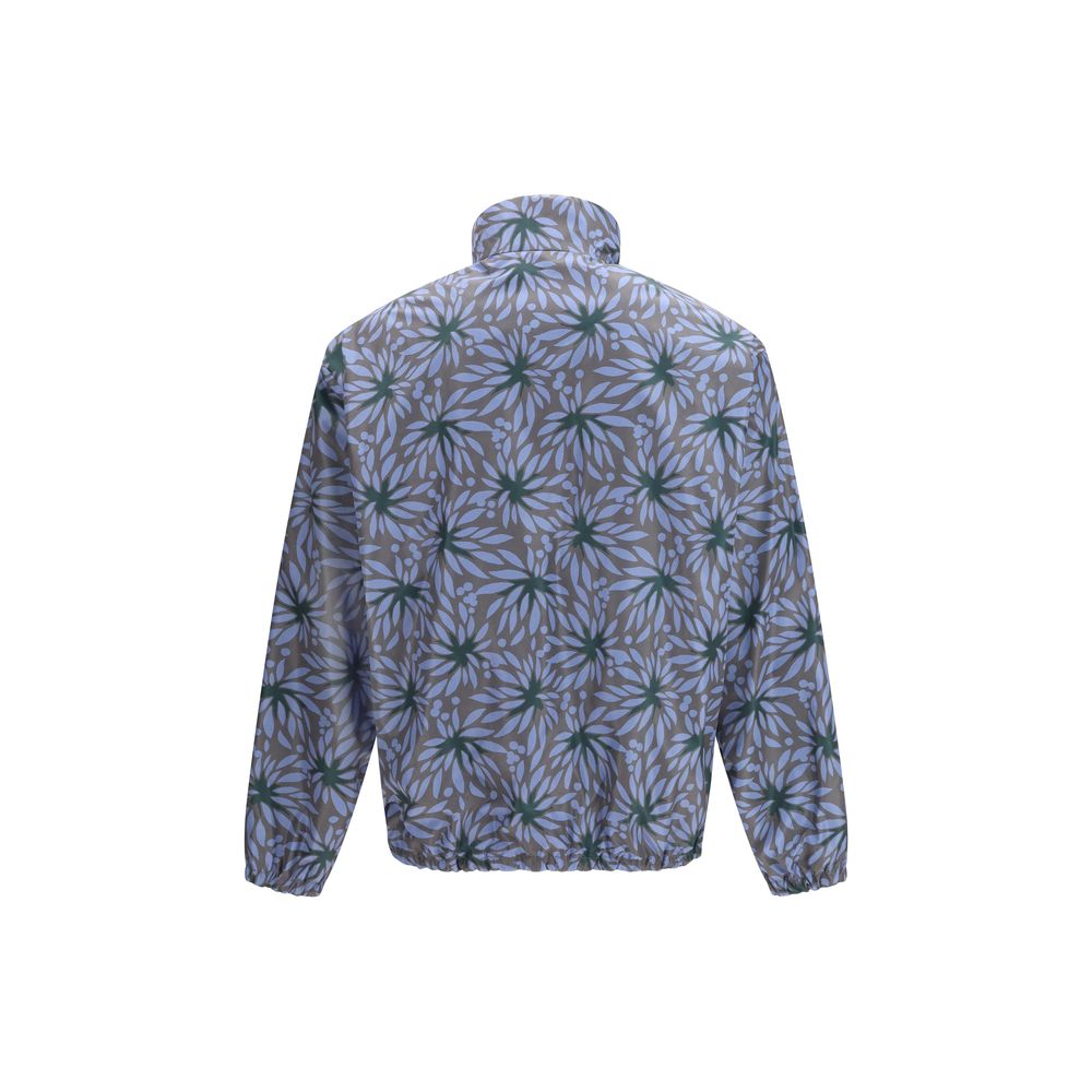 Elevate your style with the Prada Blue Recycled Polyamide Shell Jacket, a masterpiece of sustainable luxury that embodies sophistication and timeless elegance.