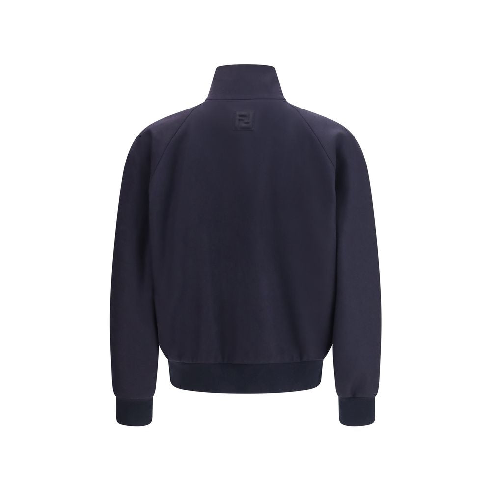 Experience the exquisite allure of the Fendi Blue Cashmere Bomber, a luxurious blend of craftsmanship and contemporary design, perfect for the discerning connoisseur.