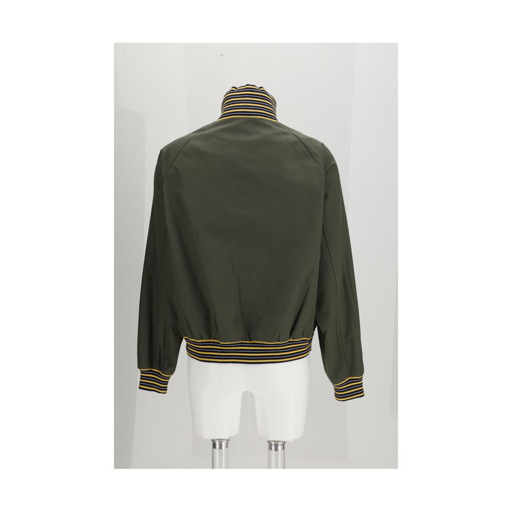 Experience the epitome of luxury with the Prada Bicolor Polyester Bomber, a masterful blend of elegance and contemporary design, perfect for the discerning individual.