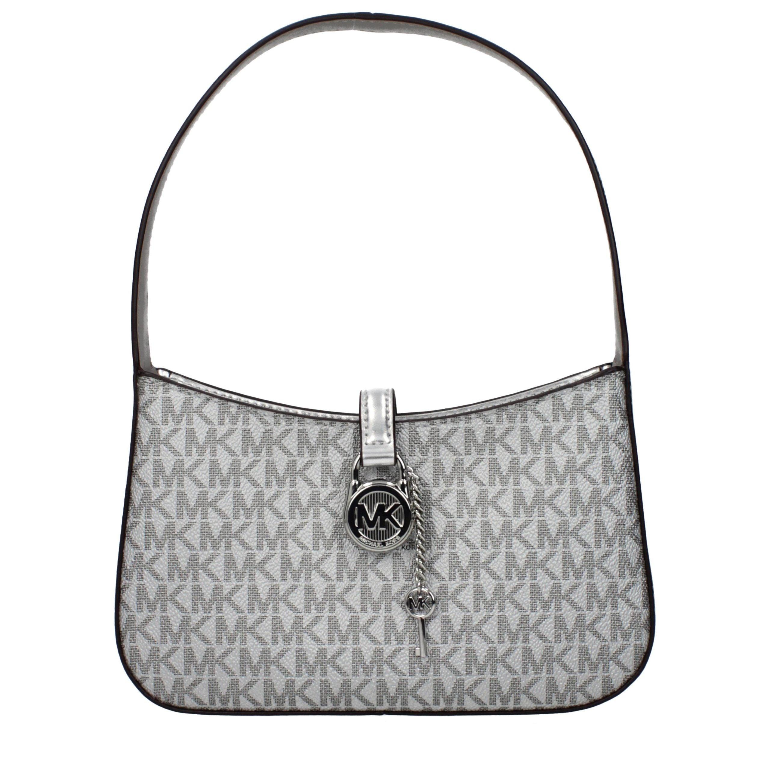 Indulge in the exquisite elegance of the Michael Kors Gray Fabric Handbag, a timeless masterpiece crafted from luxurious silver fabric, perfect for elevating any ensemble.