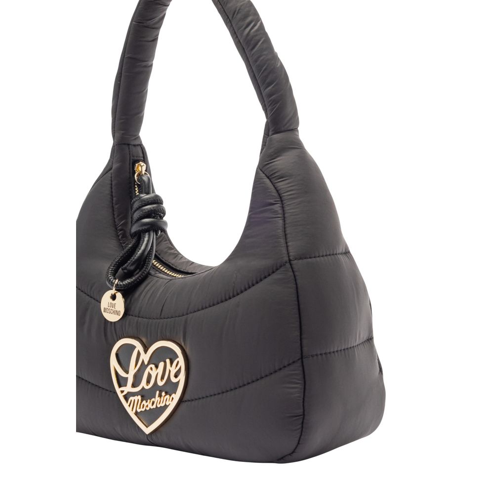 Indulge in the Love Moschino Black Nylon Handbag, a luxurious blend of nylon and polyurethane, crafted for those who embody elegance and sophistication in every moment.