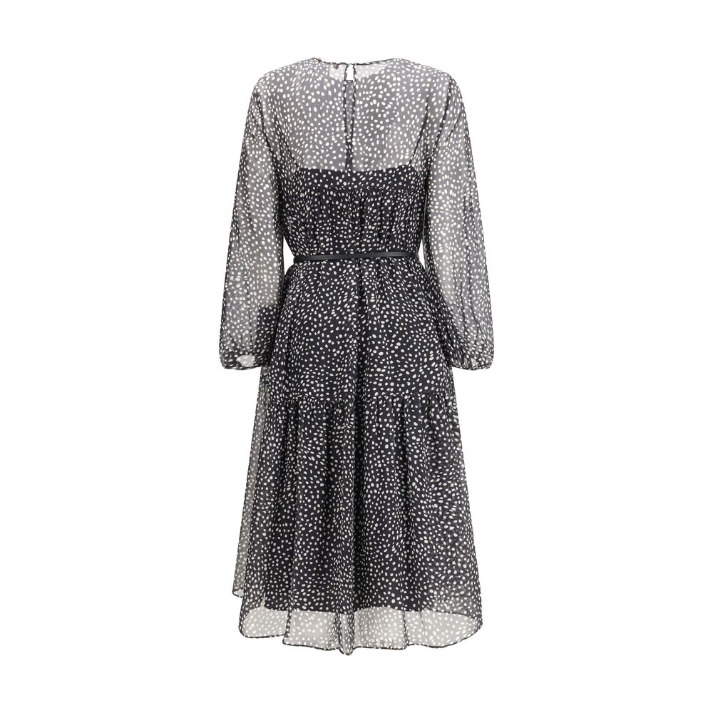 Experience the allure of Max Mara's Campo Dress, a silk masterpiece that embodies timeless elegance and exquisite craftsmanship for sophisticated occasions.