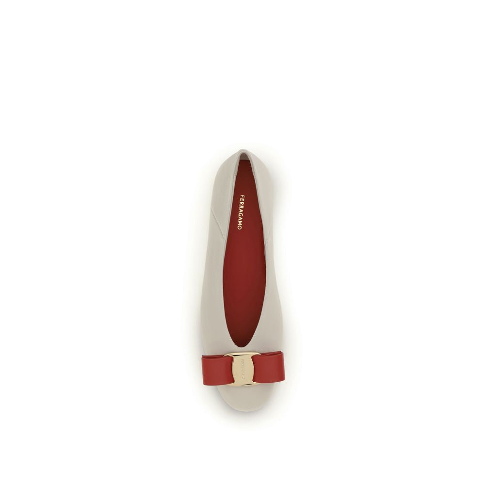 Elevate your elegance with Ferragamo White Calf Leather Bos Taurus Ballet Flats, a timeless blend of exquisite craftsmanship and modern sophistication for any occasion.