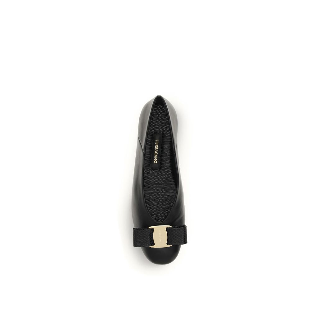 Experience the exquisite craftsmanship of Ferragamo's Black Calf Leather Bos Taurus Ballet Flats, where timeless elegance meets modern sophistication for every occasion.