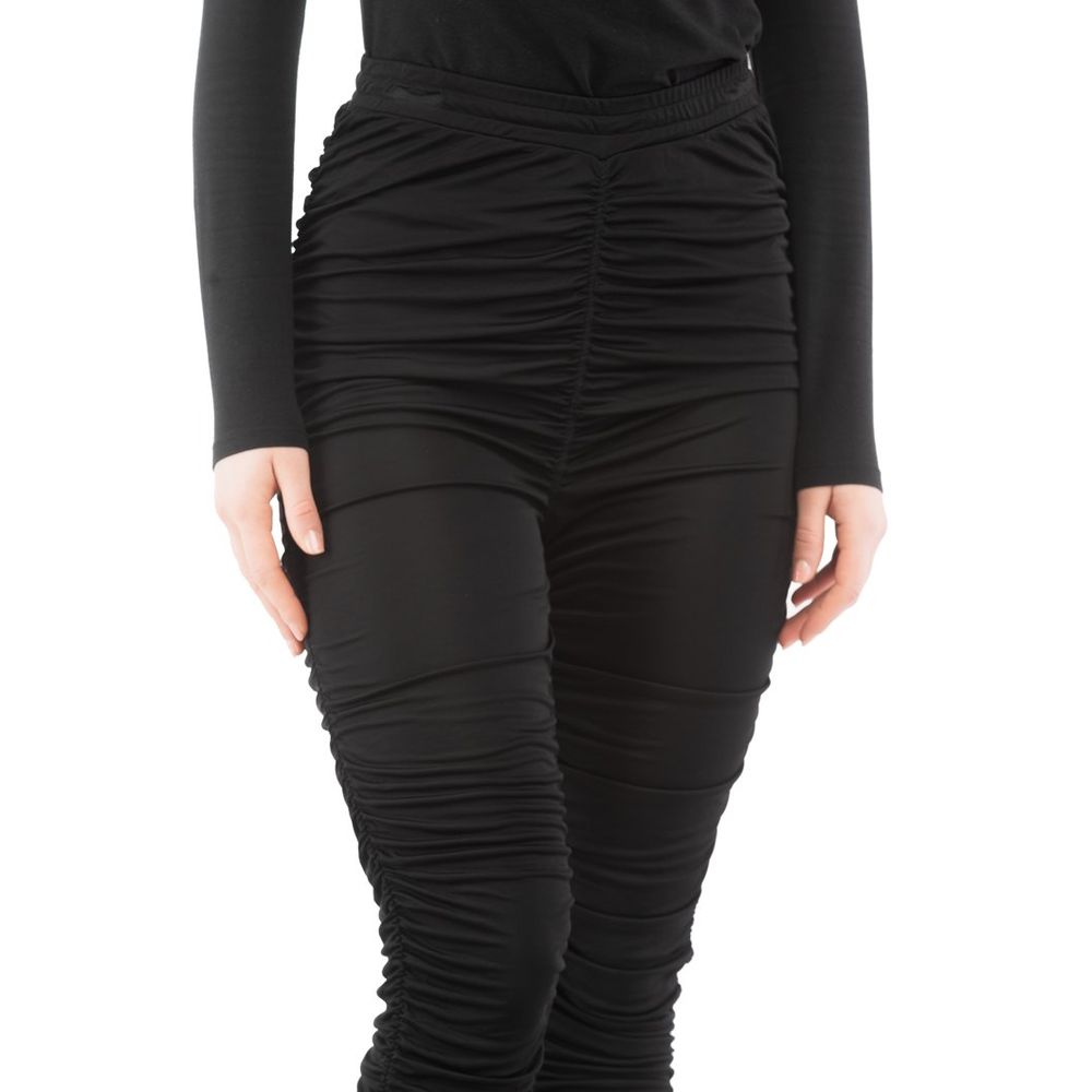 Indulge in the opulence of Moschino's Black Viscose Casual Pants, where exquisite craftsmanship meets a trendy silhouette, perfect for elevating any wardrobe with timeless elegance.