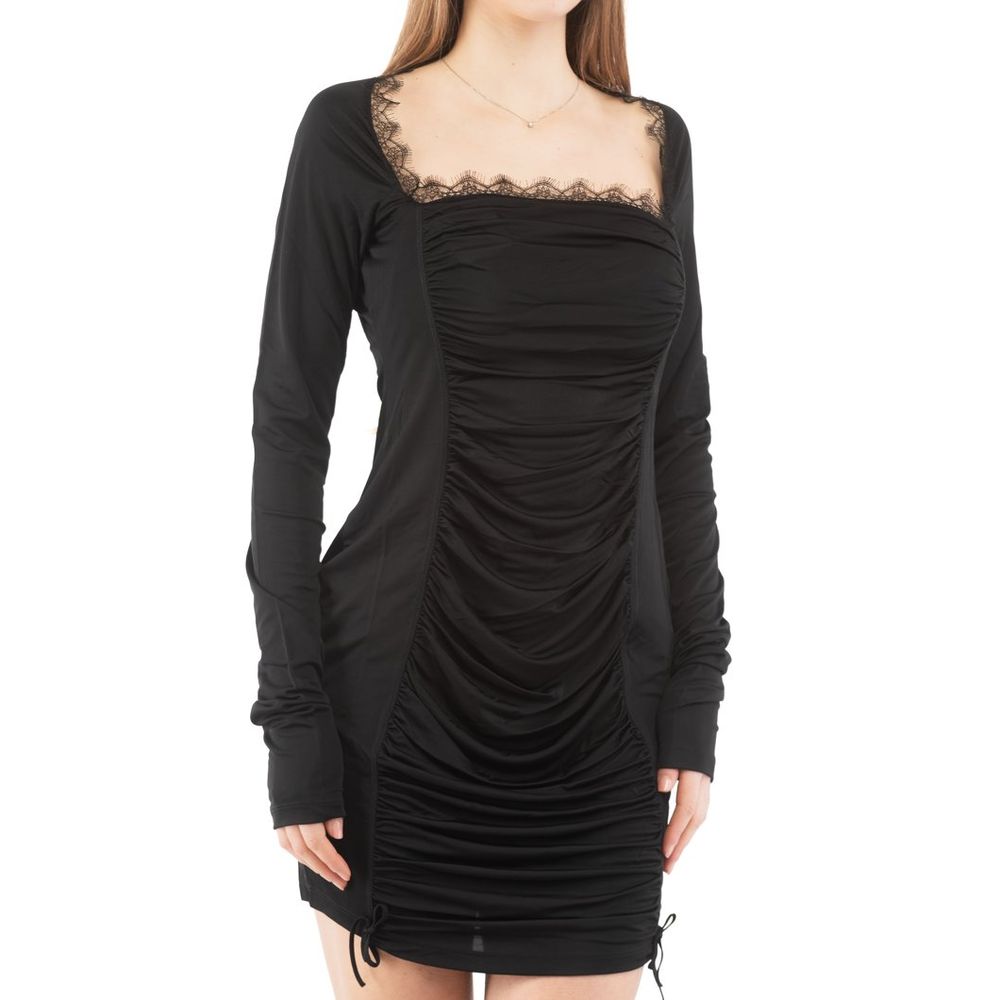 Indulge in the exquisite Moschino Black Viscose Casual Dress, a masterpiece of luxury craftsmanship that embraces your silhouette with elegance and allure, perfect for any sophisticated occasion.