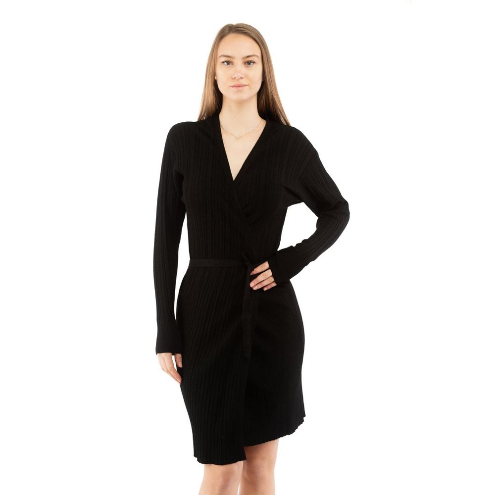 Indulge in the Moschino Black Viscose Casual Dress, where luxurious craftsmanship meets effortless elegance, perfect for elevating your style in any setting.