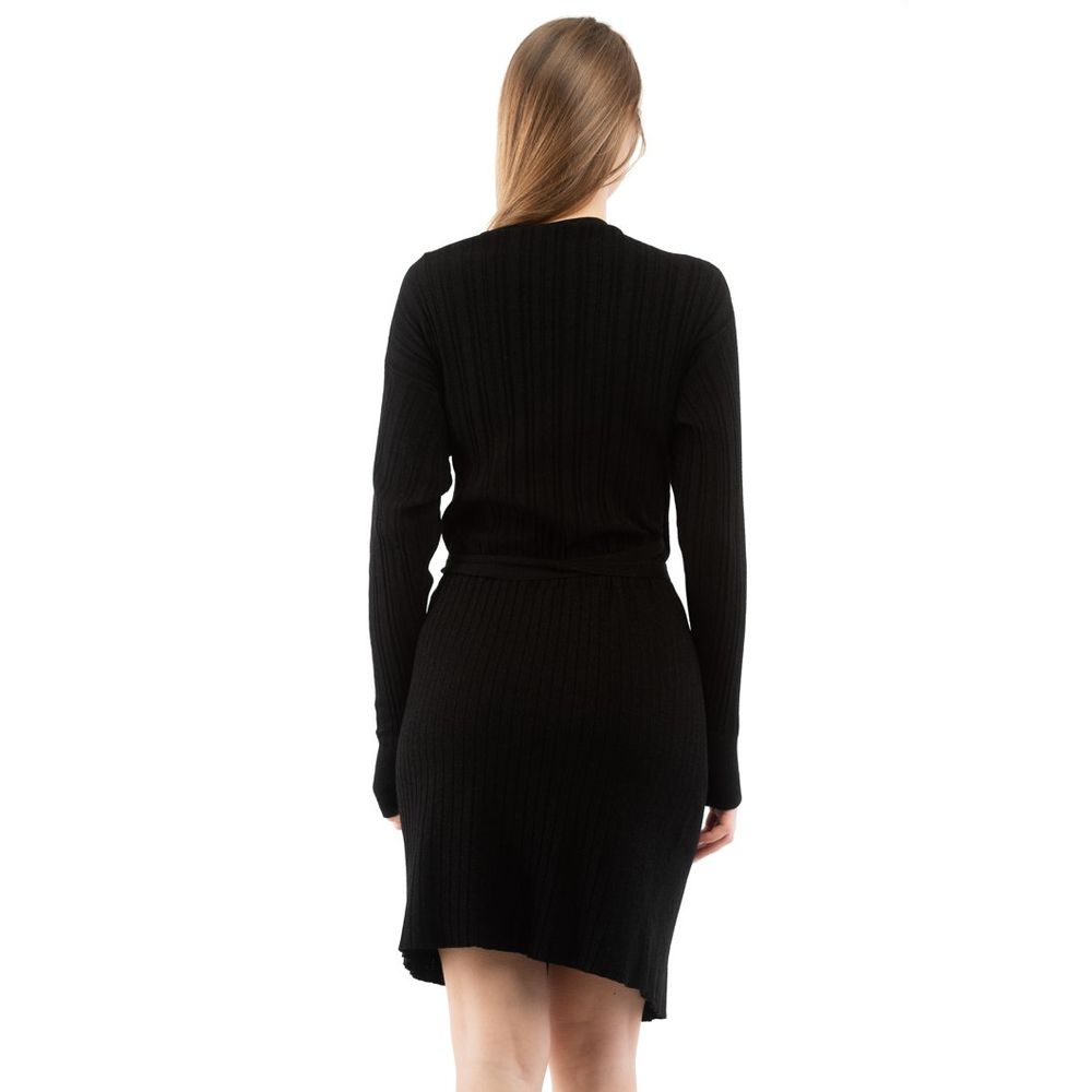 Indulge in the luxurious allure of the Moschino Black Viscose Casual Dress, a masterpiece of elegant craftsmanship designed for effortless sophistication and timeless charm.