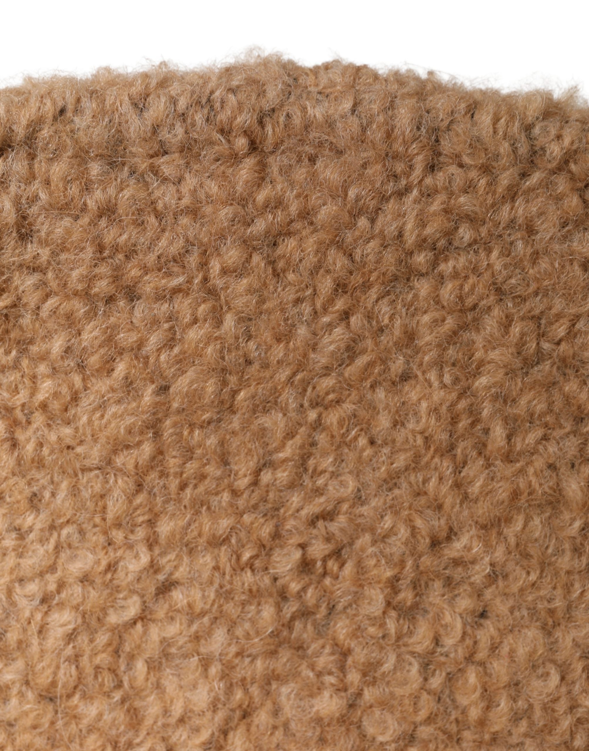 Indulge in the exquisite Dolce & Gabbana Beige Virgin Wool Capello Hat, a timeless blend of luxury and warmth, crafted in Italy for those who embody elegance and sophistication.