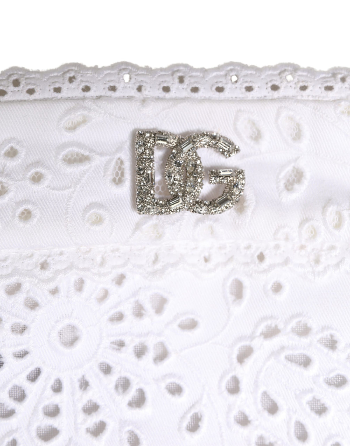 Elevate your style with the Dolce & Gabbana White Cotton Embroidered DG Crystal Headwear Hat, a luxurious blend of comfort and elegance, crafted in Italy for the discerning individual.