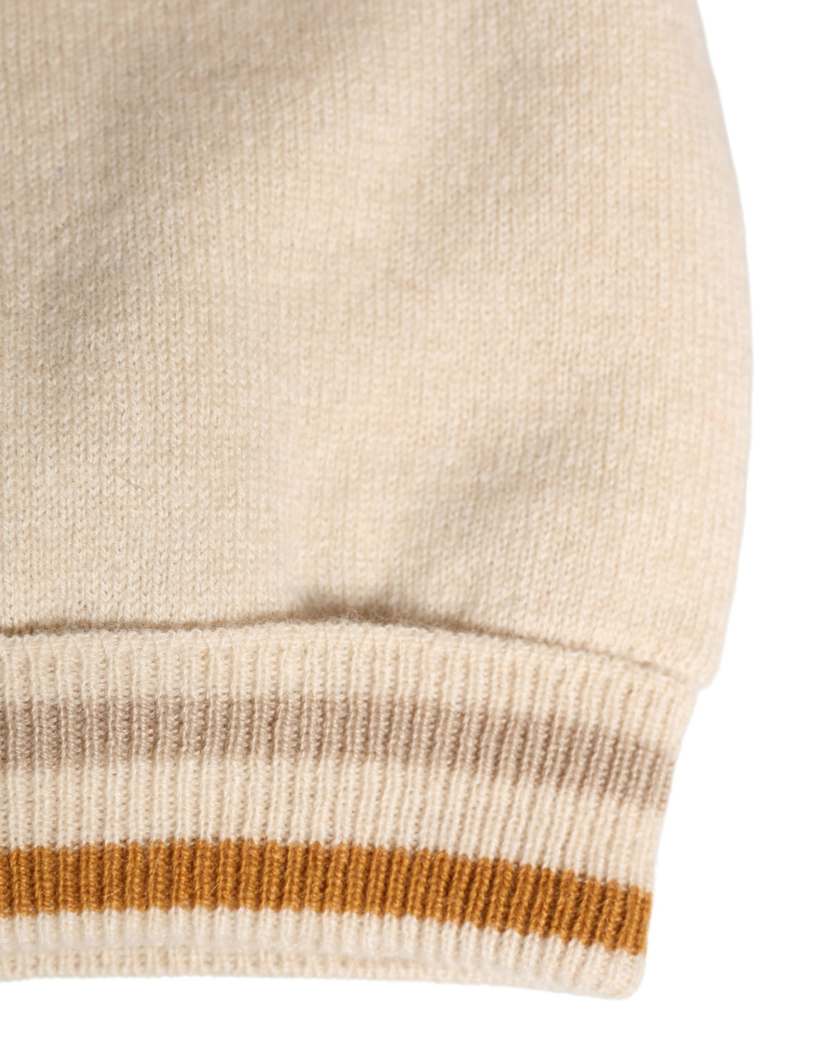 Discover the Dolce & Gabbana Beige Cashmere Knitted Women Winter Beanie Hat, a masterpiece of Italian craftsmanship that elevates your winter elegance with luxurious softness and timeless style.