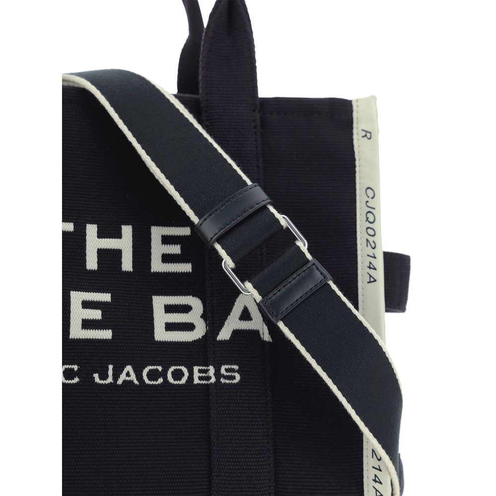 Elevate your style with the Marc Jacobs Black Cotton Handbag, a masterpiece of luxurious cotton blend, embodying sophistication and timeless elegance for every occasion.