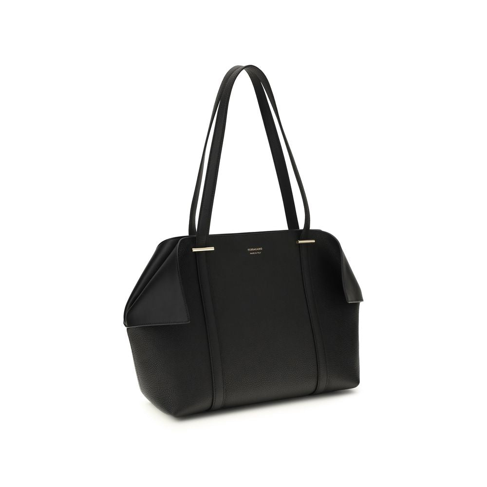 Discover the Ferragamo Black Calf Leather Bos Taurus Shoulder Bag, a masterpiece of Italian craftsmanship, blending luxury and practicality for the discerning individual.