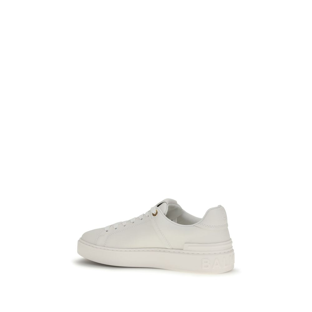 Elevate your style with Balmain White Calf Leather Bos Taurus Low Top Sneakers, where exquisite craftsmanship meets timeless elegance for the discerning individual.