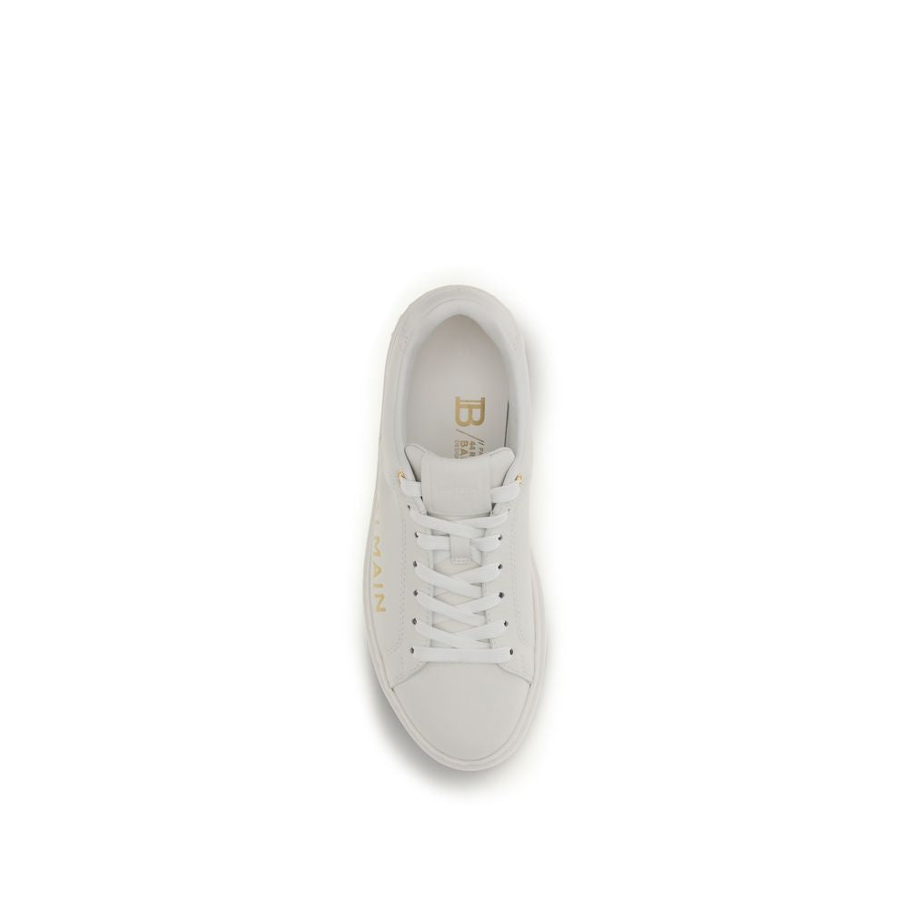 Indulge in the exquisite craftsmanship of Balmain White Calf Leather Bos Taurus Low Top Sneakers, where luxurious materials meet timeless elegance for the discerning individual.