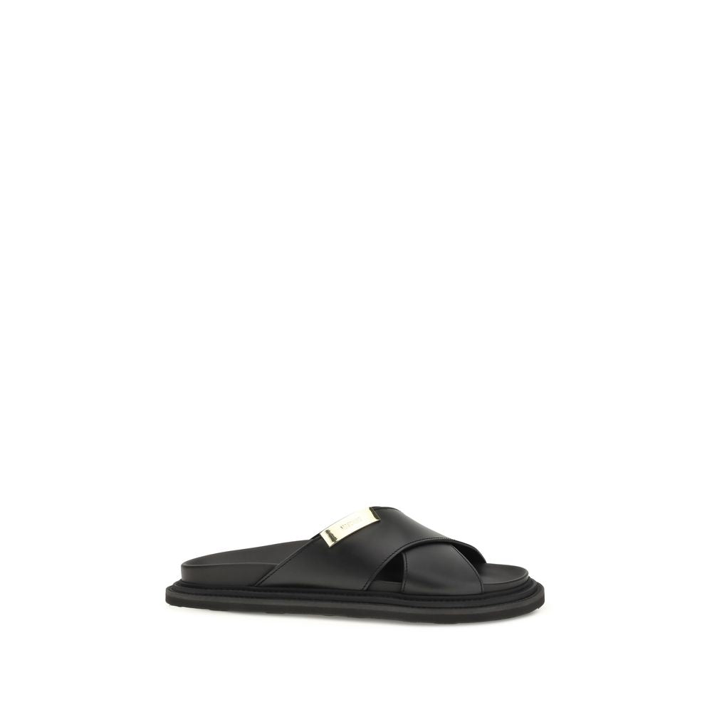 Moschino Black Calf Leather Bos Taurus Flat Sandals - Luxury Elegance
