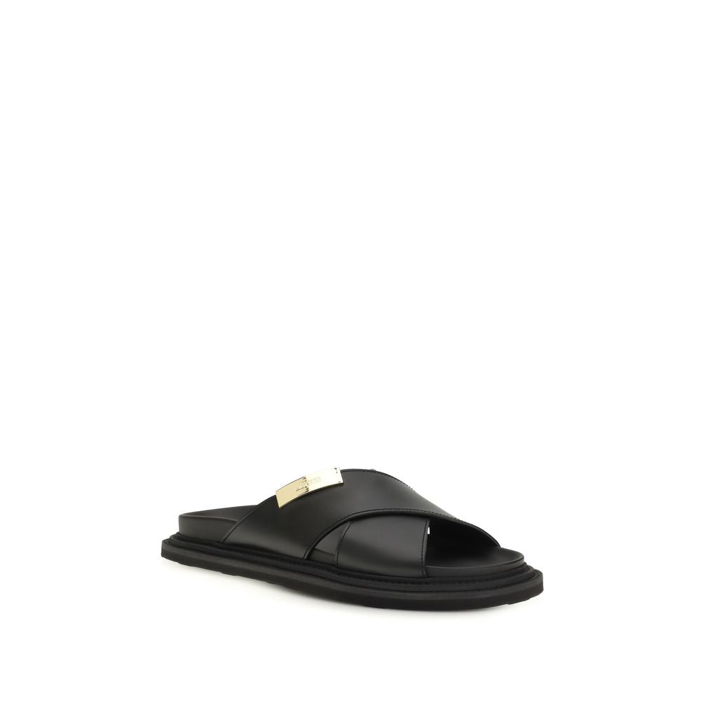 Moschino Black Calf Leather Bos Taurus Flat Sandals - Luxury Elegance