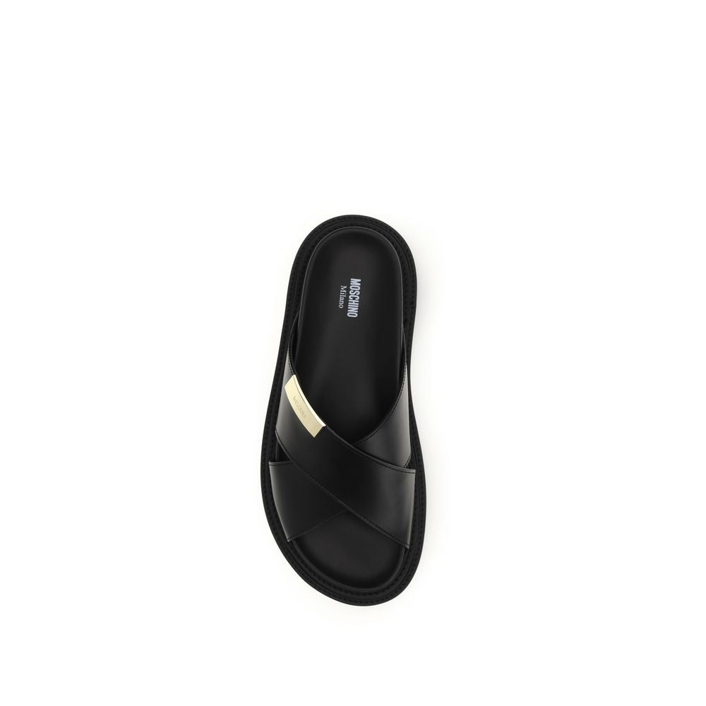 Moschino Black Calf Leather Bos Taurus Flat Sandals - Luxury Elegance