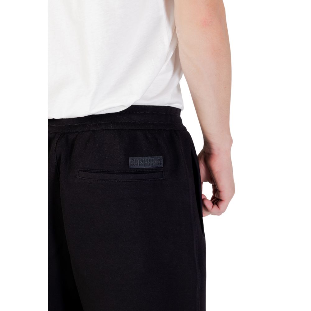 Elevate your wardrobe with Armani Exchange Black Cotton Joggers, crafted from a luxurious blend for effortless elegance and versatility in every occasion.