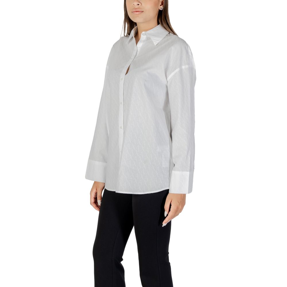 Elevate your style with the Armani Exchange White Cotton Blouse, a luxurious blend of comfort and elegance, perfect for sophisticated occasions and casual outings.