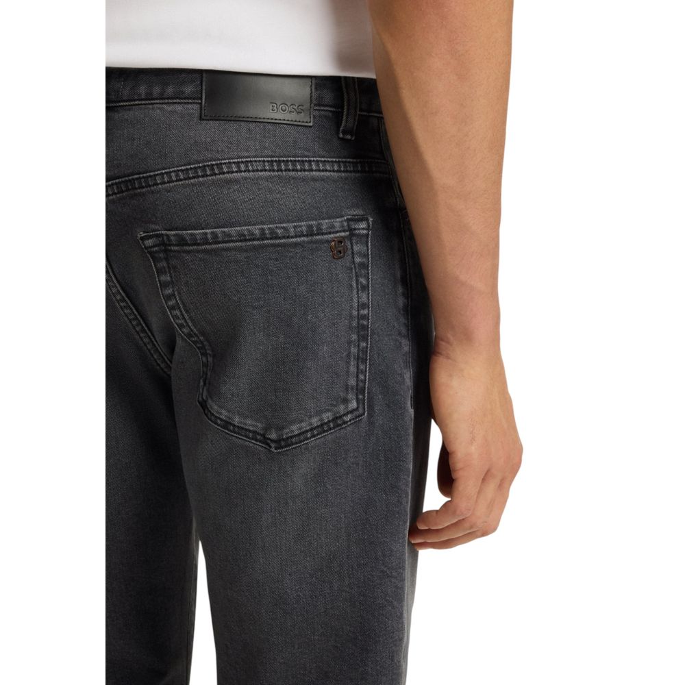 Indulge in the luxurious allure of Hugo Boss Gray Cotton Relaxed Fit Jeans, crafted from a premium cotton blend for effortless elegance and timeless style.
