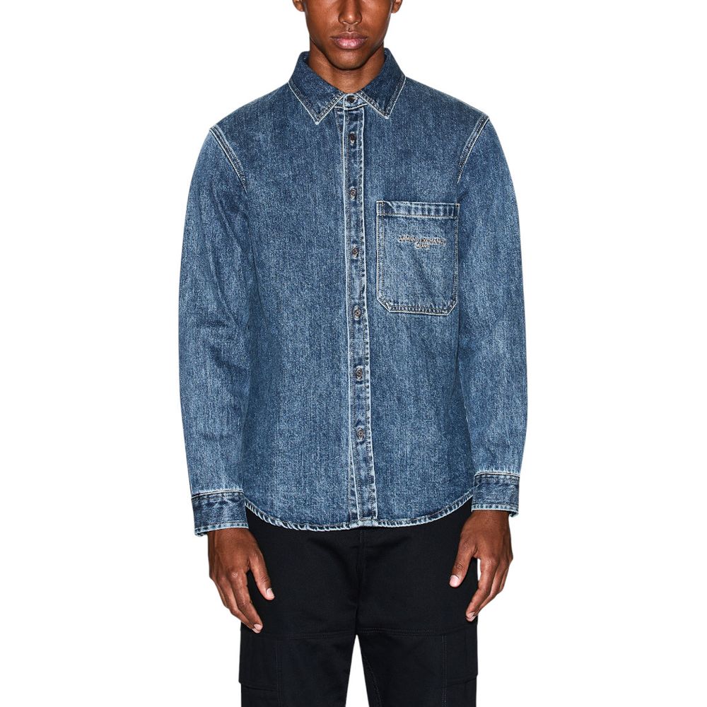 Elevate your wardrobe with the Armani Exchange Blue Denim Shirt from the FW25 collection, a luxurious blend of cotton and sophistication for timeless elegance.