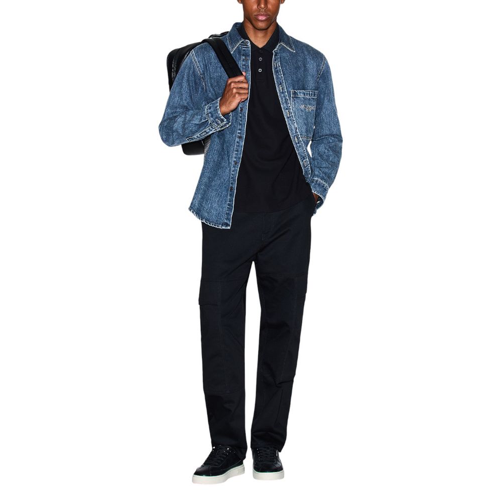 Elevate your wardrobe with the Armani Exchange Blue Denim Shirt from the FW25 collection, a luxurious blend of comfort and sophistication crafted for timeless elegance.