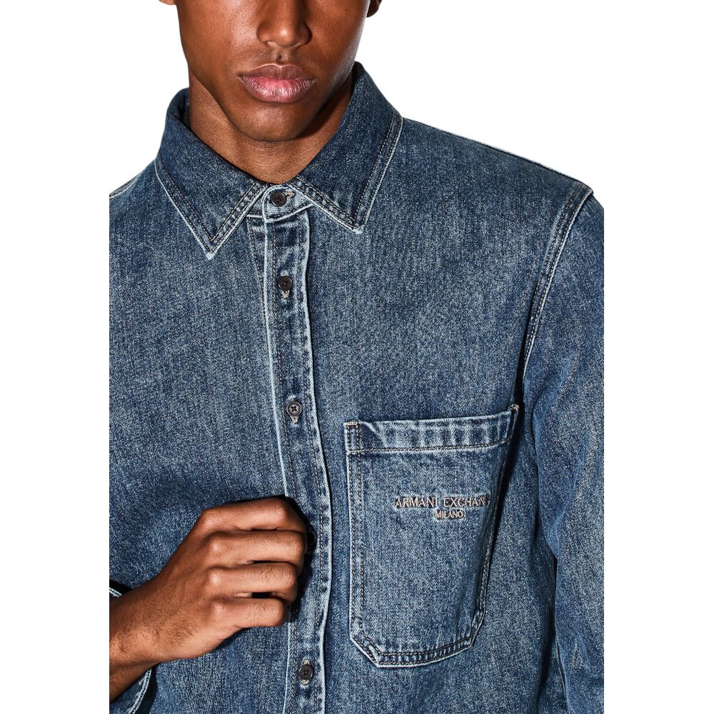 Elevate your wardrobe with the Armani Exchange Blue Denim Shirt from FW25, crafted from a luxurious cotton blend, embodying sophistication and effortless style for every occasion.