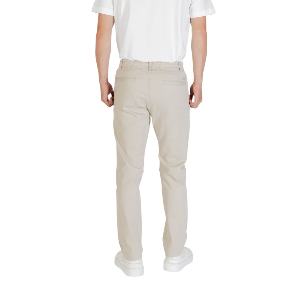 Elevate your wardrobe with the Hugo Boss Beige Polyester Casual Pants, a blend of luxurious comfort and timeless elegance, perfect for any sophisticated occasion.